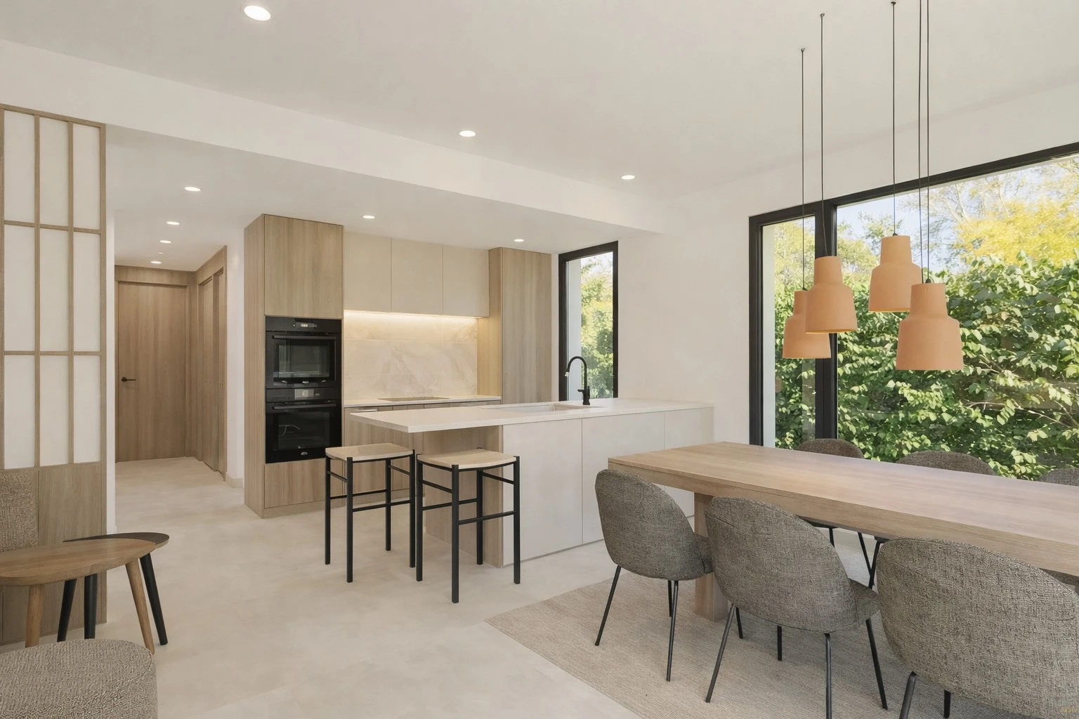 Open-plan kitchen integrated with modern dining area, central island, light wood and garden windows — Villa Cala Santanyí, Cala Santanyí, Mallorca